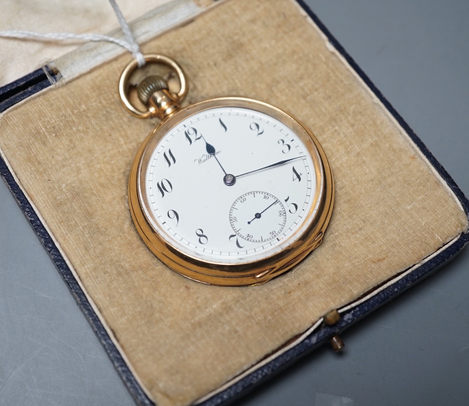 A George V 18ct gold Waltham open faced keyless pocket watch, with Arabic dial and subsidiary seconds, case diameter 50mm, gross weight 98.9 grams.